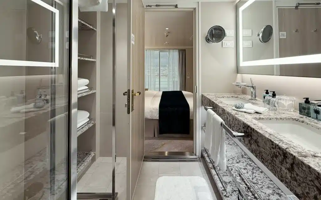 The double basin and storage shelves in a spacious Sapphire Veranda Suite bathroom.
