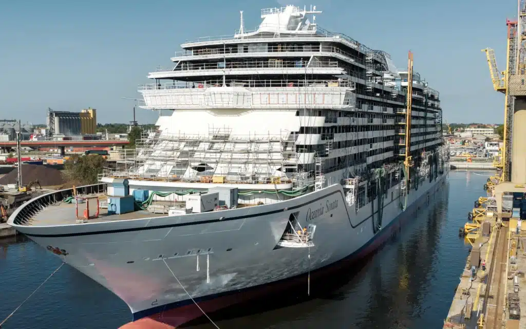 Oceania Sonata under construction in a narrow shipyard channel