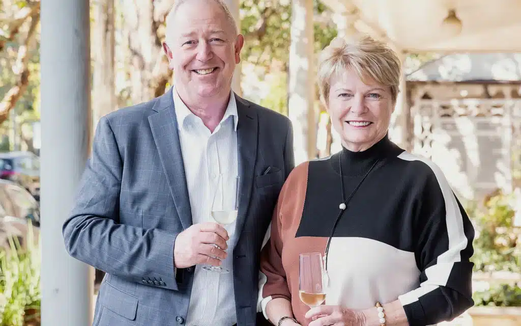 Mick Fogg and Sarina Bratton toast Pearl Expeditions' first anniversary