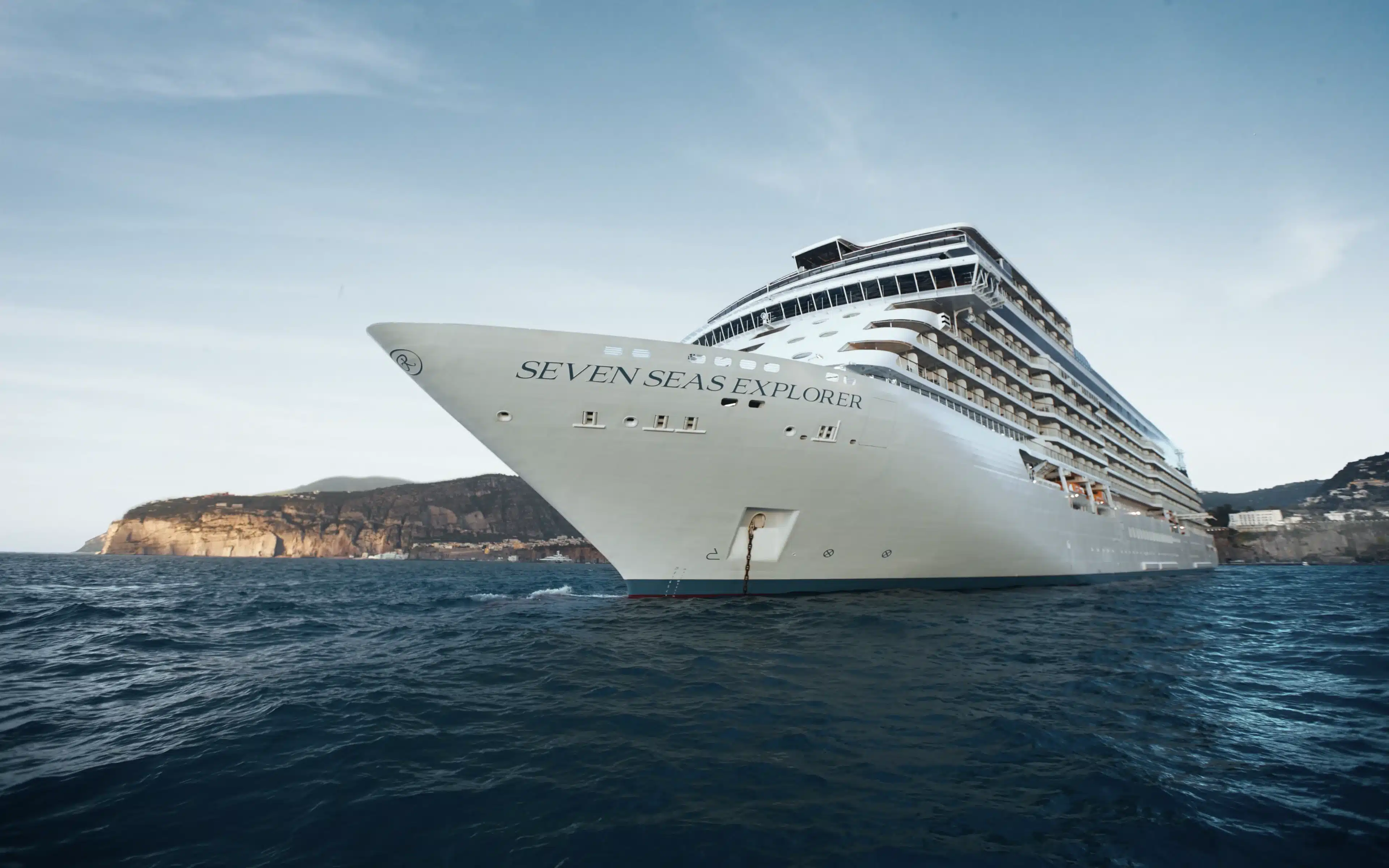 Seven Seas Explorer cruise ship anchored off the Sorrento coastline