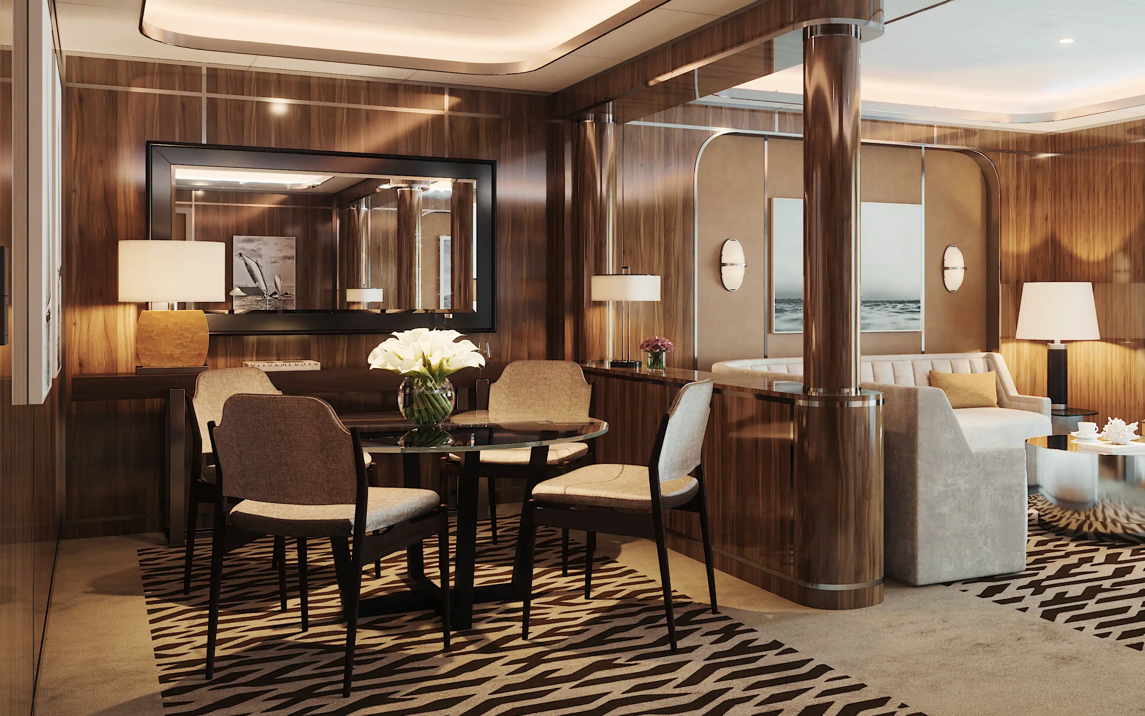 Round glass dining table with four upholstered chairs and white calla lilies in a wood-paneled Owner’s Suite aboard Atlas Adventurer